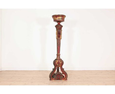 A painted wooden torchère lamp,early 20th century, Continental, surmounted with an urn above a tapering column and a pierced 