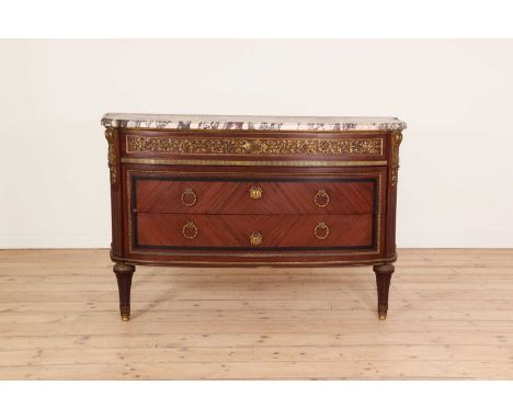 A Louis XVI-style commode,20th century, French, the brèche violette marble top over three drawers, each with ormolu mounts, r