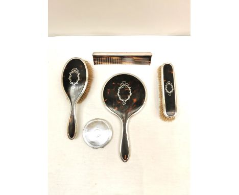 A Victorian four piece silver and tortoiseshell dressing table set along with a white metal (tests as silver) engine turned d
