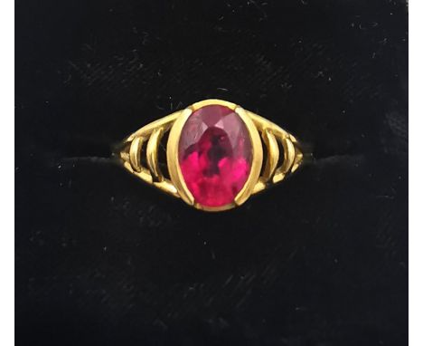 A vintage 18ct yellow gold and rubellite dress ring by Amsterdam Sauer, set with an oval mixed cut rubellite with an approxim