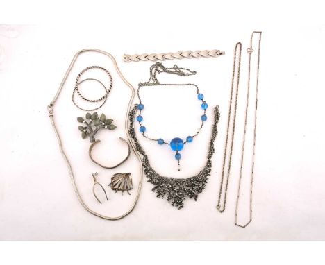 A collection of white metal jewellery, including examples of a tree pendant brooch set with labradorite cabochons and pearls,