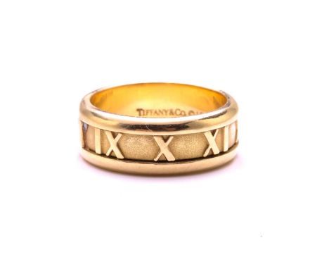 Tiffany &amp; Co. - Atlas ring, engraved with Roman numerals on a thick band, signed and marked '750 Italy', 1995, ring size 