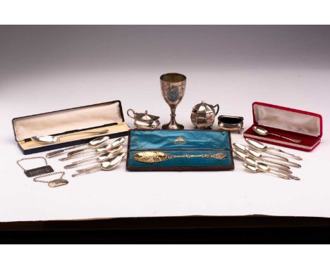 A small collection of silver items including a Victorian silver gilt presentation spoon in fitted case, a silver trophy cup, 