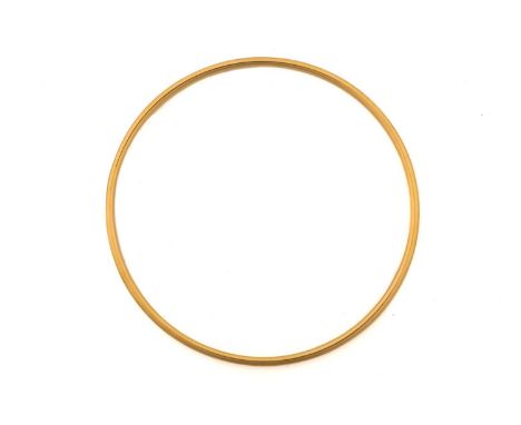Tiffany &amp; Co. - A round wire stacking bangle in 18ct yellow gold, London hallmarked '750' with maker's mark 'T&amp;Co', 2