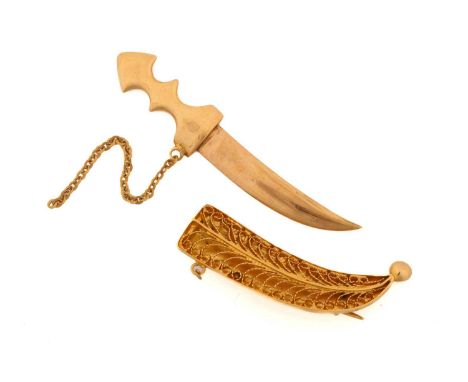 A jambiya dagger brooch, in a filigree sheath with bead finial, opening to reveal blade, fixed with safety chain, backed with