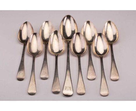A set of eight George III silver Old English pattern tablespoons and a matching basting spoon engraved with a family crest by