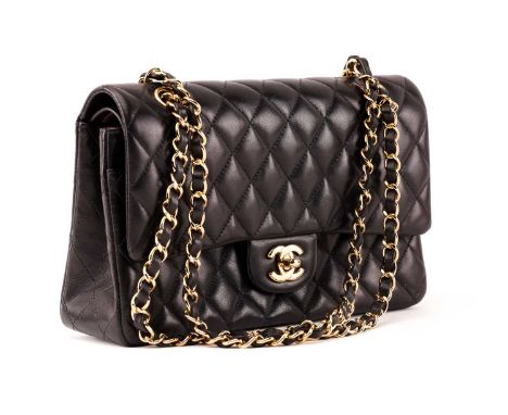 Chanel - A double flap classic handbag, quilted black lambskin with yellow tone hardware, accompanied with original dust bag,