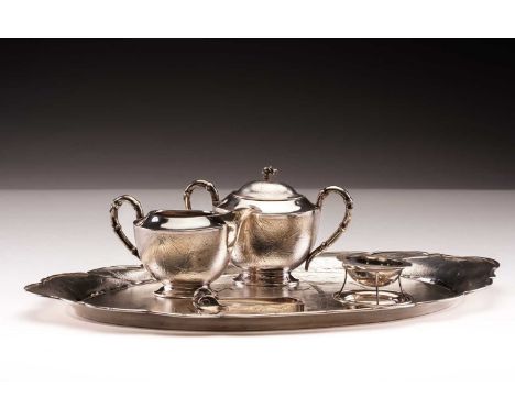A Chinese white metal tea tray; shaped oval, with bamboo engraved against a stippled ground and raised bamboo borders; engrav