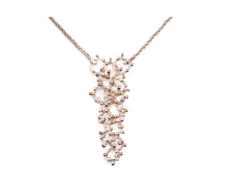 Henkel &amp; Grossé - A modernist necklace in white coloured metal, composed of forged annular rings interlacing with granula