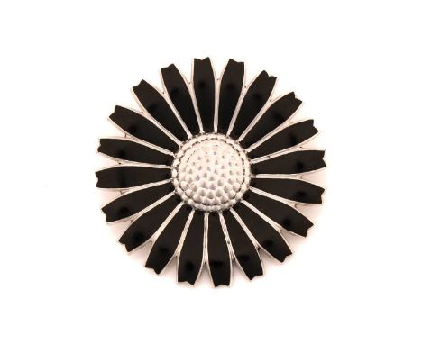 Georg Jensen - A black enamelled daisy brooch in silver, fitted with hinged pin stem and roll-over catch, stamped with post-1