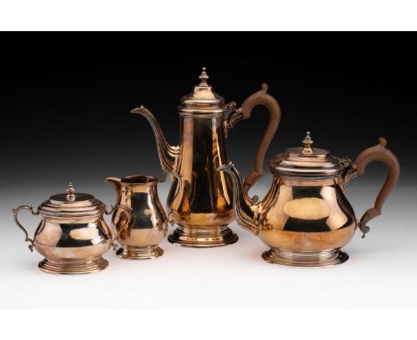 A 20th century four-piece silver tea set in George I style, of baluster form comprising a teapot and coffeepot with domed hin