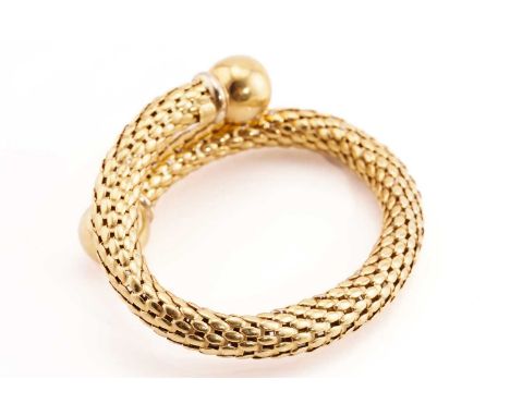 A Stella Milano bypass bangle, comprises a wraparound hollow popcorn tube of 8.8 mm in diameters, terminates with two polishe