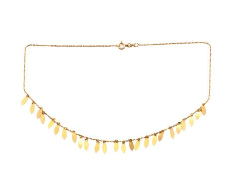 A foliate fringe necklace, of leaf motif stamped out from sheet metal, attached to a fine cable chain, fastened with a spring