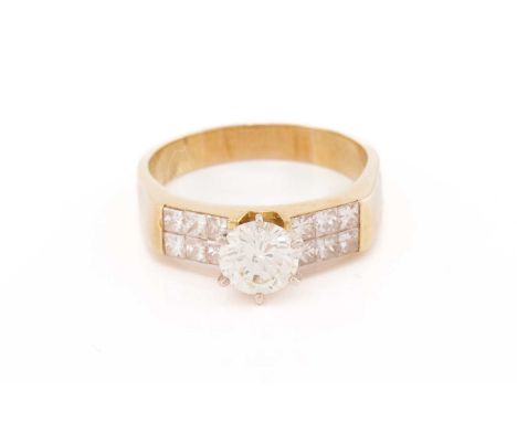 A diamond engagement ring, scintillating with a round brilliant-cut diamond in the centre, approximately measures 6.7 mm in d