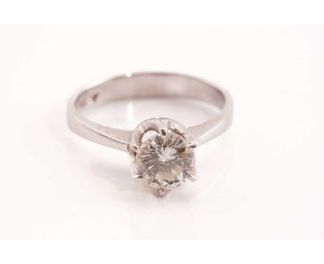 A diamond solitaire ring, scintillating with a round brilliant-cut diamond of 6.6 x 6.6 x 4.0 mm in high profile six-claw set