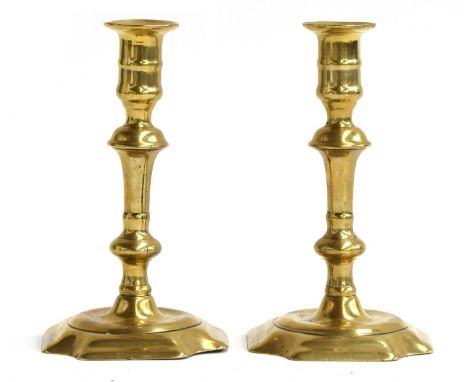 A pair of brass candlesticks by Joseph Wood and George Grove, cut corner bases, brazing lines in both stems, both marked Jose