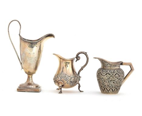 A George III silver cream jug, maker's mark rubbed, London 1786, helmet shaped with beaded edged rim and strap handle, bright