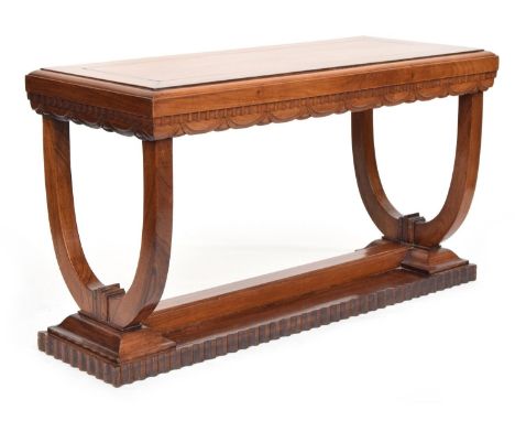 A French Art Deco rosewood console table, carved with dentil frieze above swags, raised no two U supports and pedestal base,&