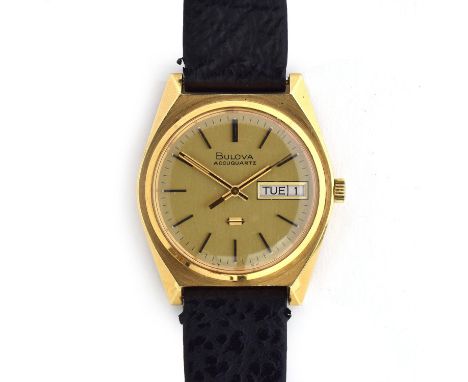 A BULOVA ACCUQUARTZ GOLD FILLED WRIST WATCHCirca 1974, champaign dial, raised baton markers, transition movement, tuning fork