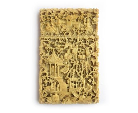 A 19th century Chinese export ivory card case of rectangular form, elaborately carved in relief with figural and architectura