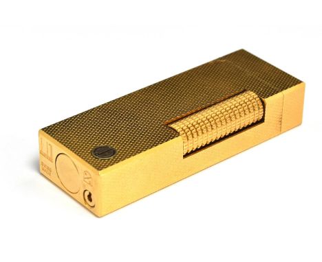 A gold plated Dunhill Rollagas lighter with engine turned decoration, 6.4cm high, in fitted Dunhill case 