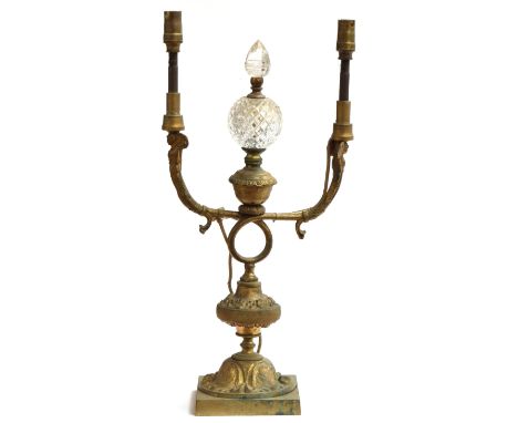 A Victorian gilt two arm table lamp with cut glass central finial, on square base, 41cm high 