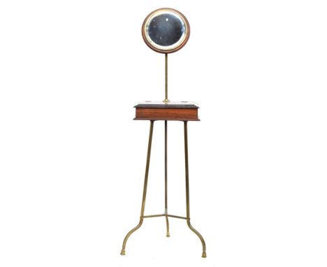 A 19th century mahogany shaving stand with adjustable circular bevelled mirror, on a brass tripod support, 134cm high 