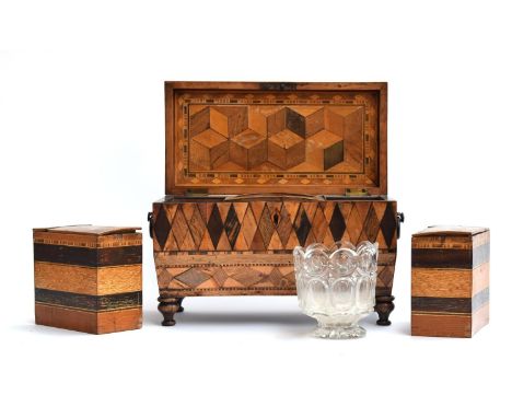 An early 19th century parquetry tea caddy, with removable boxes and glass mixing bowl, each side with two carved wood loop ha