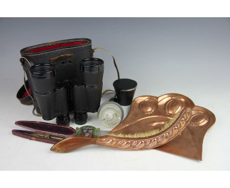 An Arts and Crafts copper crumb scoop, embossed with pomegranates by Joseph Sankey & Sons, a similar copper mounted brush, a 
