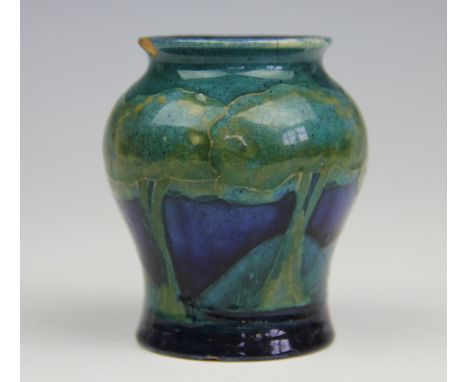 A Moorcroft Moonlit Blue pattern vase circa 1925, shape number 146, impressed marks, 8cm high (chipped)
Three chips to neck, 