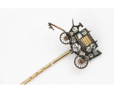 A stick pin in the form of a horse drawn carriage, realistically modelled and set with graduated old cut diamonds throughout 