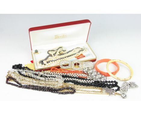A selection of jewellery to include; a graduated garnet bead necklace with marcasite set clasp, a Japanese ivory bangle Meiji