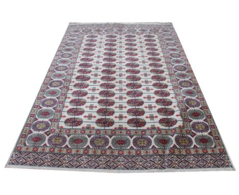 A Kerman brushed cotton carpet, decorated with an allover geometric design against an ivory ground, 230cm x 153cm 