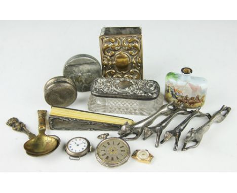 A selection of silver and objects of vertu comprising; a Merlin '18k' ladies watch face, a Victorian silver topped jar, a 'fi