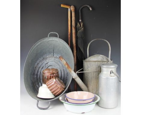 A selection of vintage kitchen and gardening items, to include a ribbed watering can, two copper jelly moulds, initialled GM,