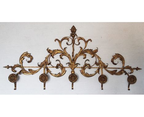 A Regency style gilt metal wall bracket, decorated throughout with scrolling acanthus leaves, with five flower head hooks / a