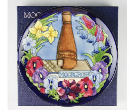 A Moorcroft 1997 limited edition centenary plate, commemorating 100 years of production, 183/750, 22cm diameter, with painted