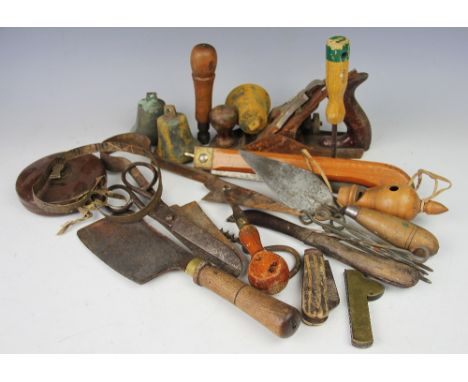 A miscellany of 19th century and later objects of vertu and farming tools, to include an oversized treen whistle, two bells e