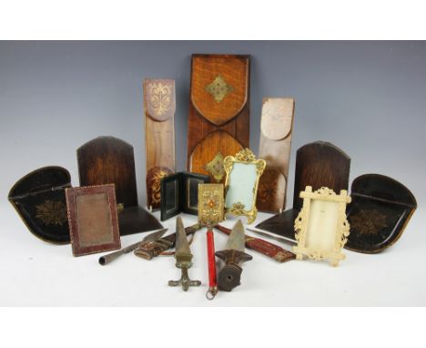 A collection of 19th century and later photograph frames, including a carved ivory frame decorated with violets, circa 1900, 