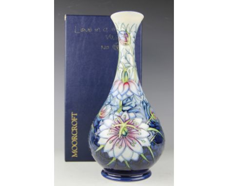 A Moorcroft limited edition Love in a mist vase, presented by William John Moorcroft, No.183/300, painted 'WM' and '183/300' 
