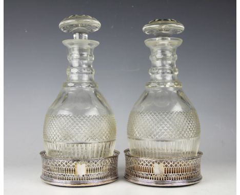 A pair of 19th century silver plated and pierced decanter coasters, with turned wood bases, 13cm diameter, with a pair of Reg