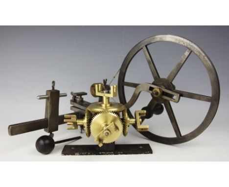 A 19th century steel watch makers lathe, stamped FENN, with treen handle and brass fittings, wheel 24cm diameter, with a gun 