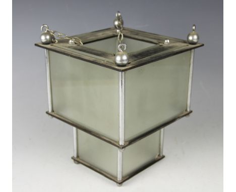 An Art Deco style chrome, bakelite and frosted glass hall lantern of stepped cube form, 24cm high, with a pair of gilt wood t