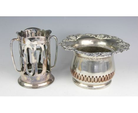 A silver plated Art Deco twin handled 'Soda Water' bottle coaster, 17cm high, and a large Victorian champagne coaster with a 
