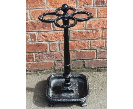 A 19th century cast iron stick / umbrella stand by Wood Bishop & Co, four scroll divisions on square base, base with cast mar