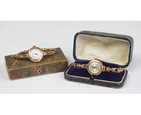 A ladies 9ct gold wristwatch, early 20th century, the circular silver dial with Roman numerals and attached expanding bracele