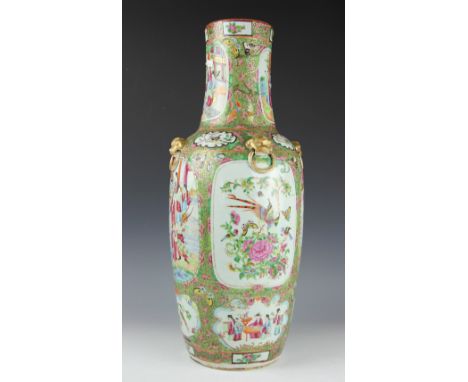 A large 19th century Chinese Canton famille rose vase, the rouleau form vase finely enamelled with multiple panels depicting 