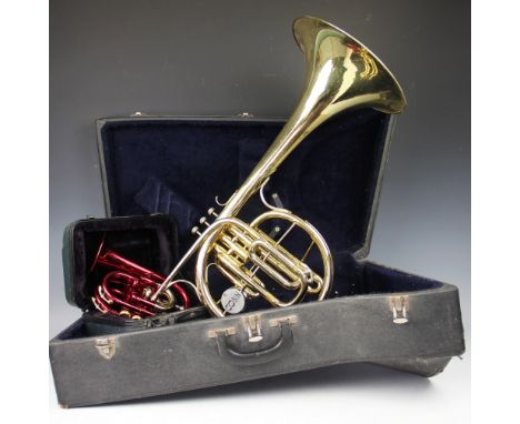 An American lacquered brass Mellophonium by Conn, number HE150119, in case with mouth piece (Please note that the cornet in t