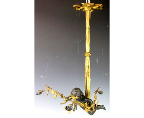 A 19th century ormolu figural three branch ceiling light, modelled a as a cherub suspended by a bow tied cherub, 67cm (at fau