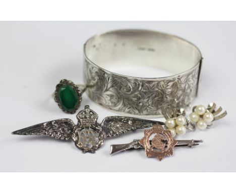 A selection of silver jewellery, to include; a silver bangle Birmingham 1933, engraved ivy and scrolling design, along with a